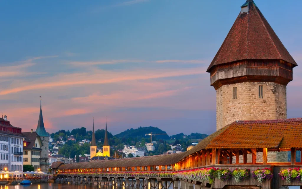 Chapel Bridge and Water Tower at dusk in Lucerne, Switzerland