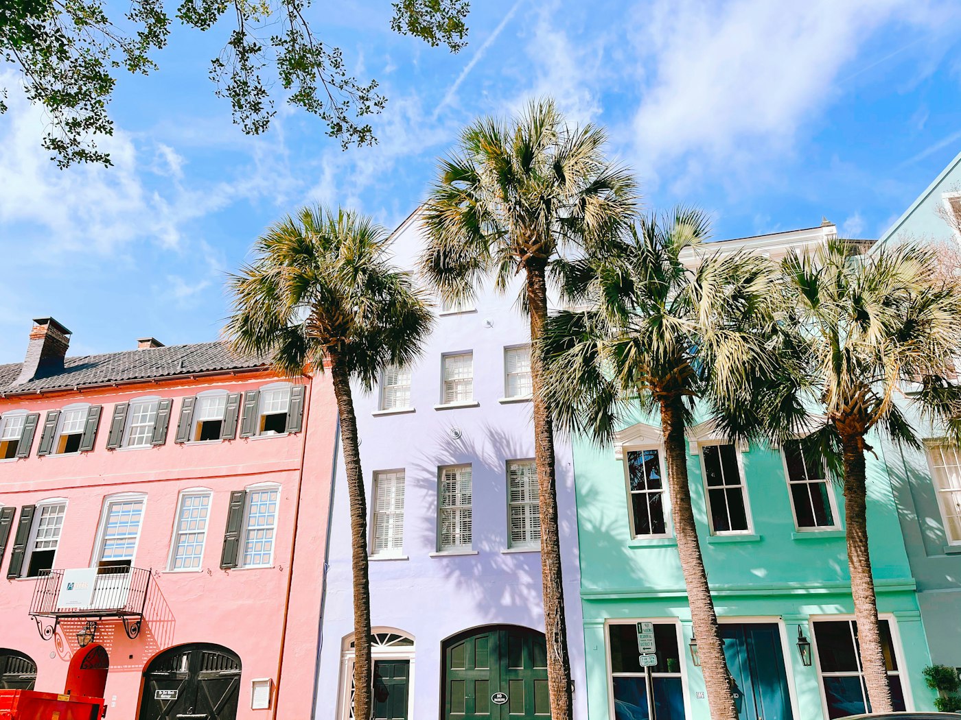 Pastel historic homes and palmetto trees in Charleston, South Carolina