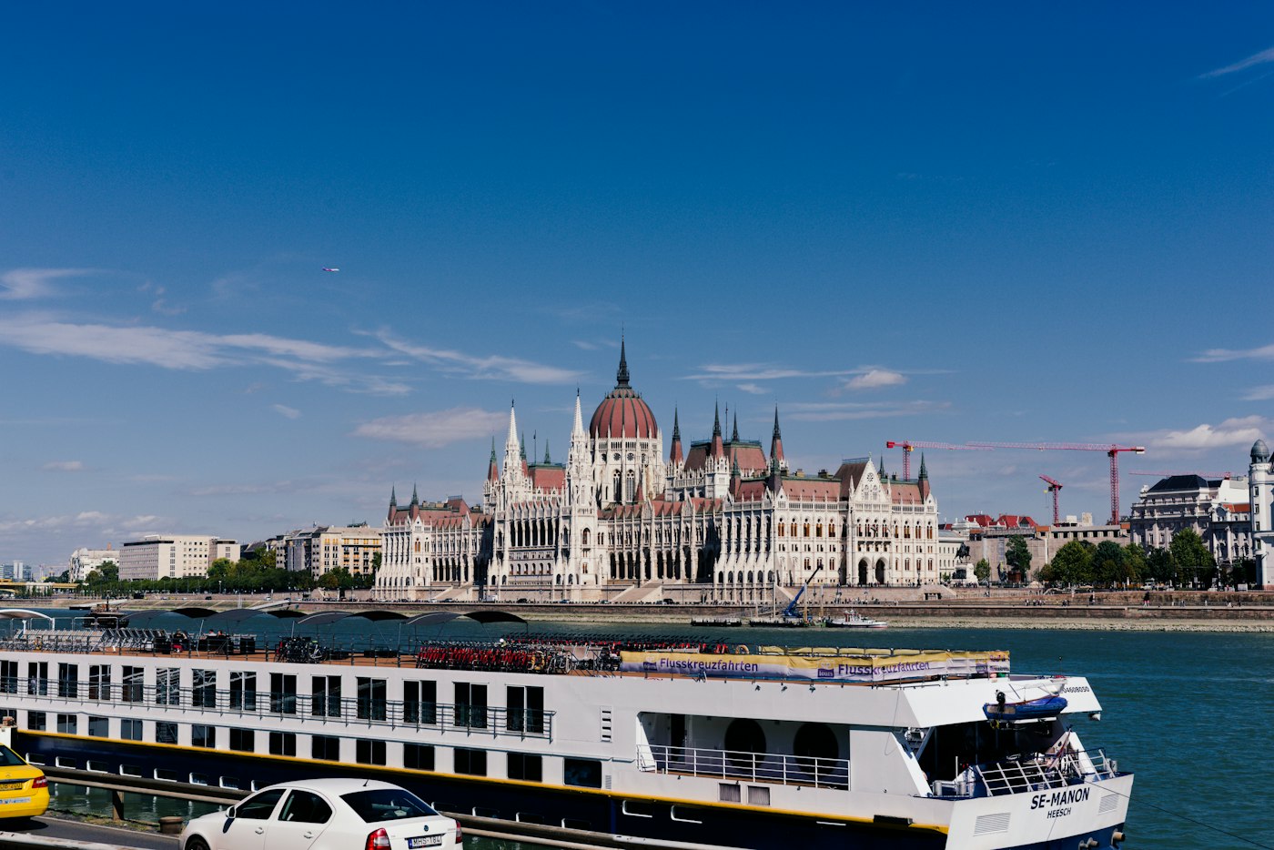 River cruise ship passing the Hungarian Parliament in Budapest