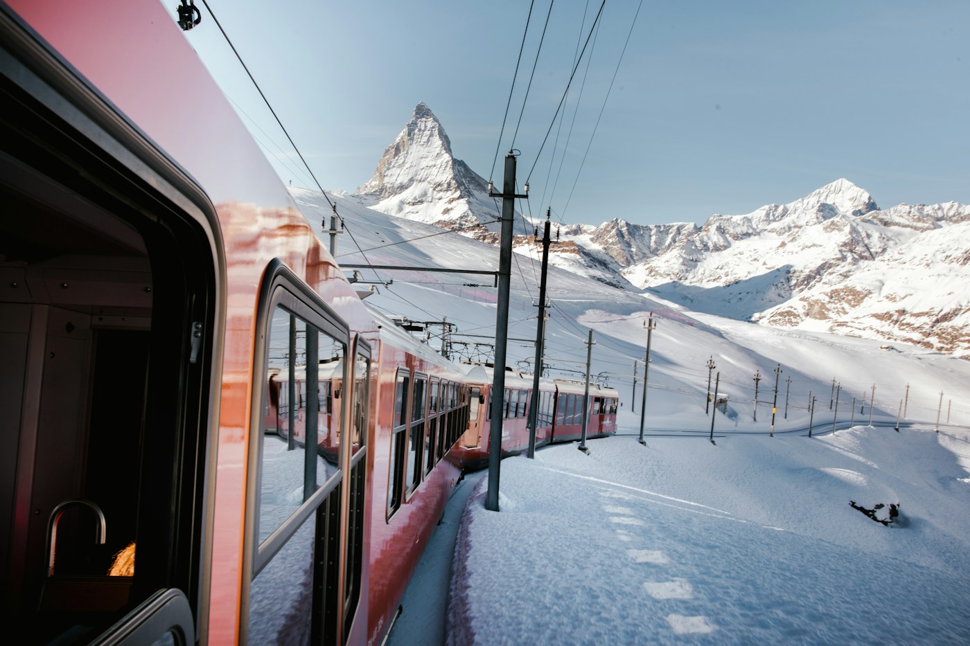 View of the Matterhorn from the window of a train traveling through snow