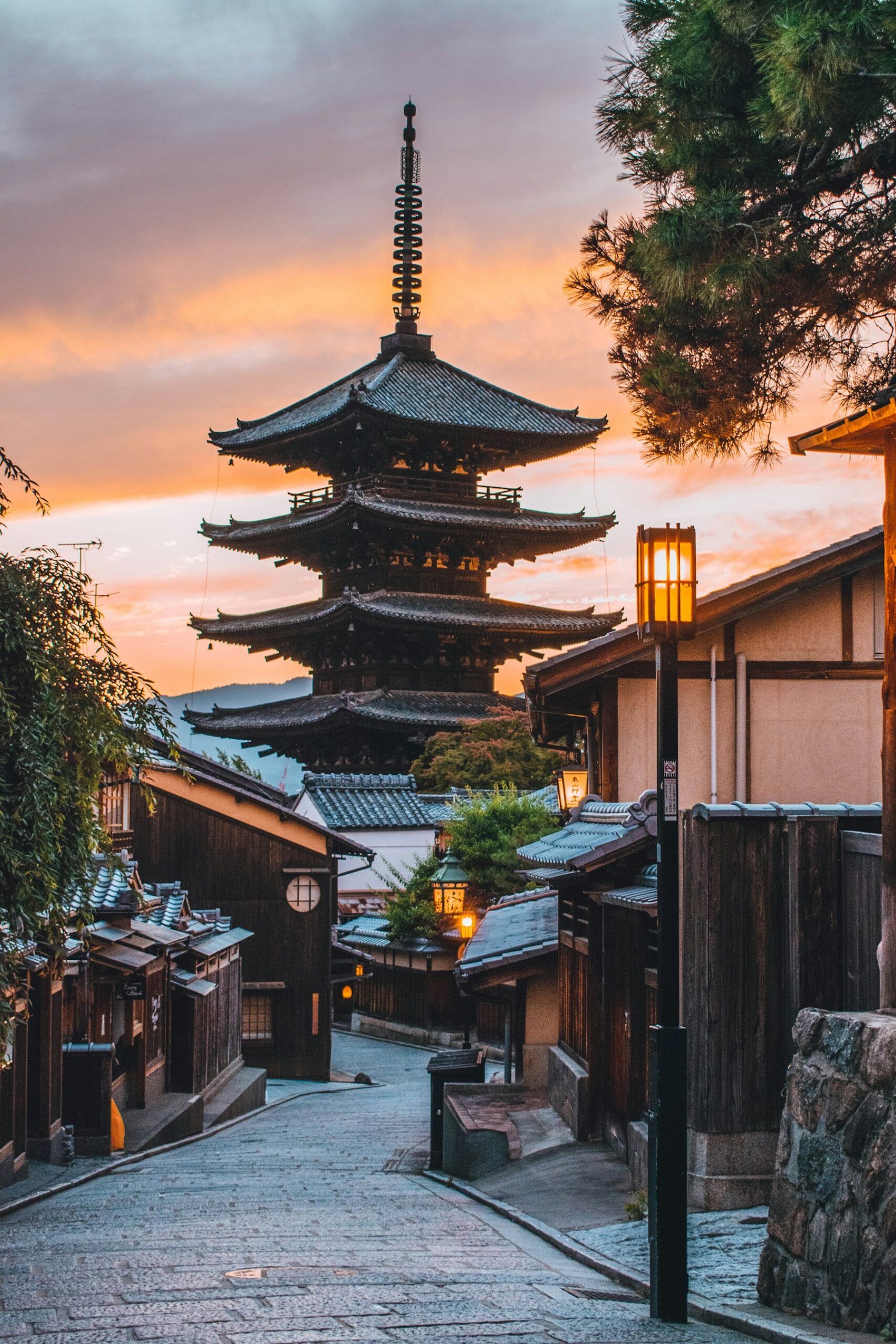 Yasaka Pagoda above a narrow street in Kyoto, Japan, at golden hour